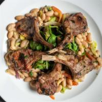 Grilled Baby Lamb Chops · Served over white cannellini beans, fresh tomato, and cilantro with baby greens and roasted ...