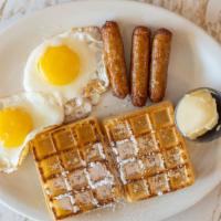 Waffle Deluxe · Served with two eggs any style and a choice of meat.