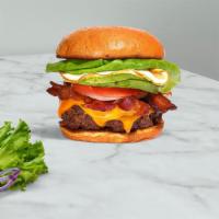 Morning Break Burger · American beef patty topped with bacon, fried egg, avocado, melted cheese, lettuce, tomato, o...