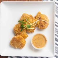 Chick'N Nuggets · Gluten free. Crispy gluten-free chick'n nuggets breaded with cornmeal, oven baked to a golde...