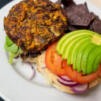 Subia'S Burger · Gluten free option.  A sweet potato, french lentil and kale burger, topped with avocado, tom...