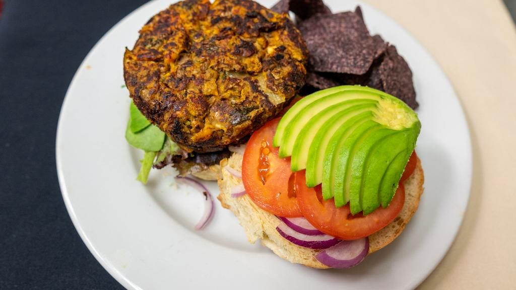 Subia'S Burger · Gluten free option.  A sweet potato, french lentil and kale burger, topped with avocado, tomato, mixed greens and onions, served with our cilantro-curry mayo. Served with a side of coleslaw.