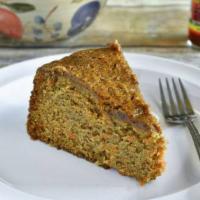 Vegan Carrot Cake · Slice of unfrosted, vegan carrot cake.