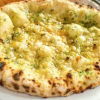 Garlic Bread. · our dough baked with garlic, parsley butter, and red pepper flakes