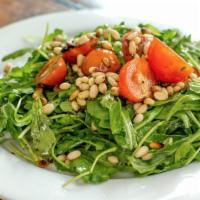 Arugula Salad. · with marinated cherry tomatoes and basil, toasted pine nuts and a balsamic vinaigrette