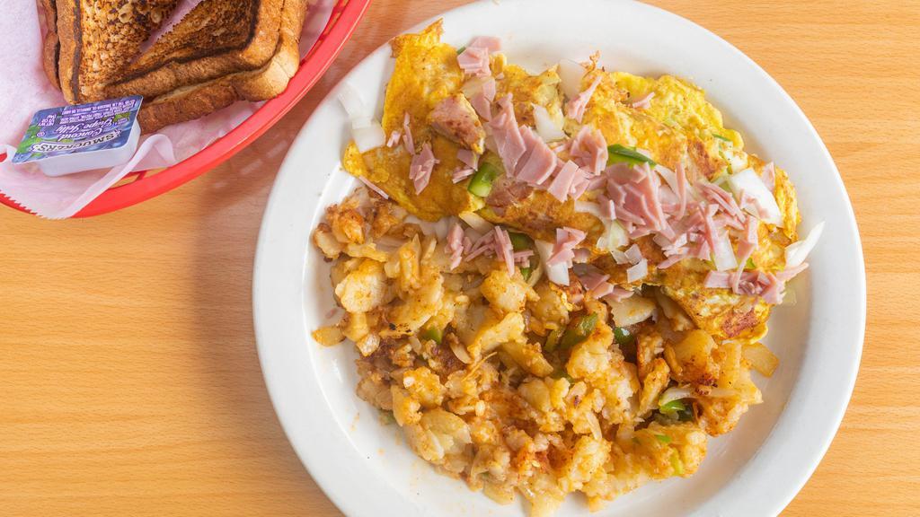 Western Omelette · 3 large eggs, ham, peppers and onions
Home fries and your choice of bread.