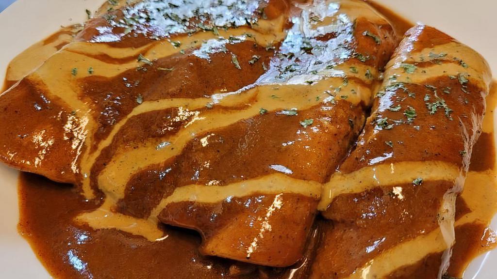 Enchiladas · Gluten free. Corn tortillas stuffed with your choice of beans, cheese, or jackfruit.