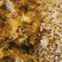 Sweet Potato Curry · Gluten free. Curried sweet potato, sautéed with onions and spinach. Paired with brown rice.