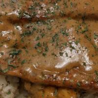 Bangers & Mash · Contains soy. Mashed potatoes topped with sausages and homemade gravy.