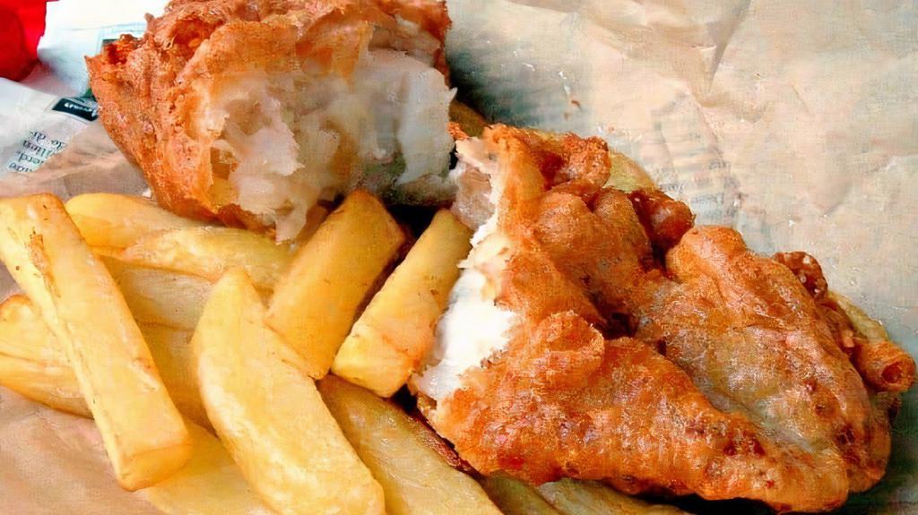 Fish & Chips · Beer battered cod dish served with French fries and served with tartar sauce and our award winning coleslaw. Served with house salad