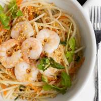 Green Papaya Salad · Shredded green papaya and carrots topped with shrimp and spicy vinaigrette with mint.