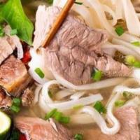 Spicy Beef Soup · Served with yellow noodles or white noodles.