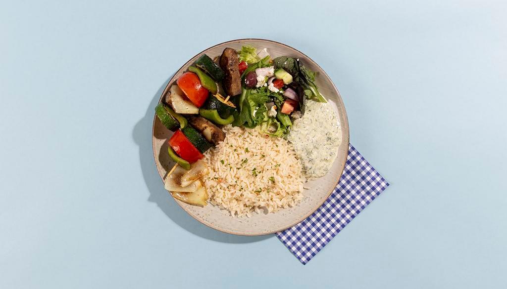 Grilled Vegetable Rice Platter · Grilled eggplant, zucchini, and peppers served with rice, salad, pita bread, and tzatziki.