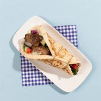 Ground Beef Kabob Pita · Grilled ground beef kabob wrapped in a pita with lettuce, tomato, onion, and tzatziki.