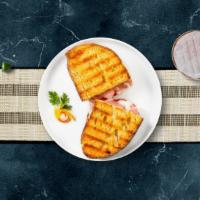 Turkey Melts Panini · Ovengold turkey, salsalito turkey, melted vermont cheese, beef bacon, grilled onions and pep...