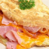 The Meat Lover Omelette · 3 freshly scrambled egg whites mixed with crispy bacon, pork roll, smoked sausage, country h...