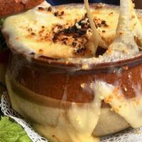 French Onion Soup · Small cup. Topped with Swiss cheese.