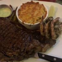 Surf And Turf Ribeye Steak (12Oz) With Jerk Or Grilled Shrimp · Ribeye steak(12oz) and jerk (or) grilled shrimp with whipped parmesan potatoes, French garli...