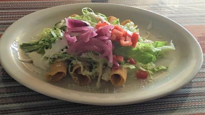 Lunch Flautas Pollo · Two deep fried corn tortillas filled with chicken then topped with cheese sauce. Served with rice and side of sour cream.