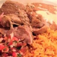 Carnitas · Slow roasted pork chunks. Served with rice, beans, pico de gallo and three flour tortillas.