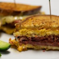 Classic Reuben · Corned beef, Swiss cheese, and sauerkraut grilled hot on a flat top. Served on Orwashers see...