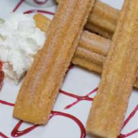 Churros · Served with a chocolate dipping sauce