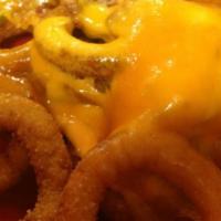 Lord Of The Rings · Onion rings with melted cheddar cheese and our homemade Thousand Island dressing.