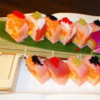 Passion Roll · 10 pieces. Spicy white tuna, crunch, mango wrapped in soy bean paper topped with tuna, salmo...