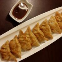 Fried Mandoo (4 Pieces) · Homemade dumplings filled with pork and vegetables.