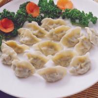 Steamed Mandoo · Homemade dumplings filled with pork and vegetables.