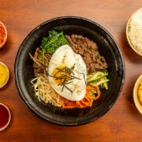 Beef Bulgogi Bibimbap · Medley of vegetables. Topped w/ fried egg and Marinated Beef.
