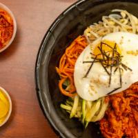 Spicy Pork Bibimbap · Medley of vegetables topped with fried egg and spicy pork.