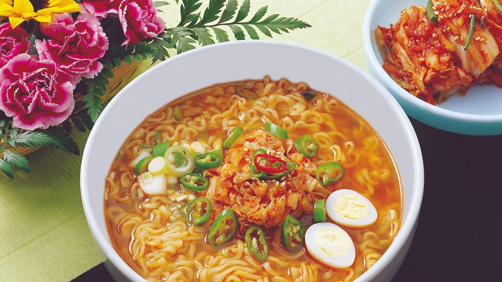 Korean Spicy Ramen · Noodles with vegetables and egg in spicy beef broth.