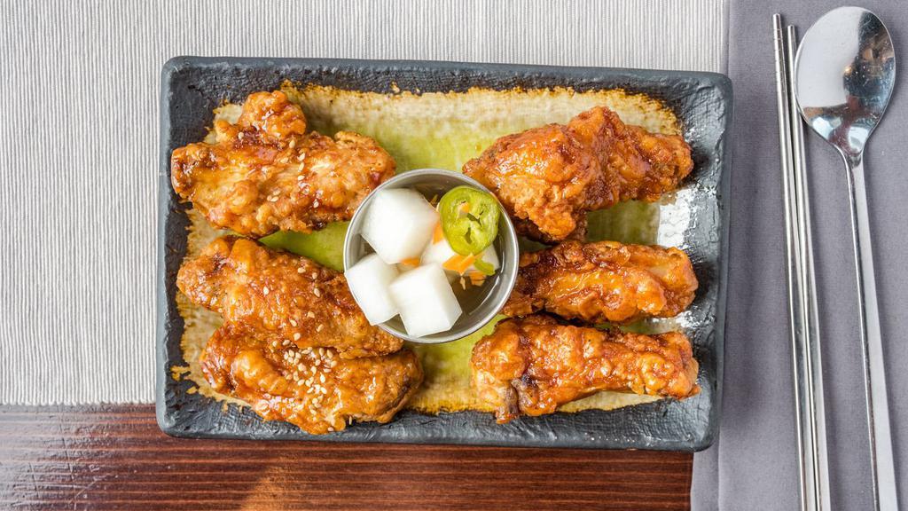 Korean Fried Chicken (6 Pcs.) · Chicken wings glazed with soy garlic sauce or spicy gochujang sauce. Served with pickled jalapeno radish.