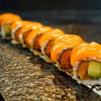 Sunshine Roll · Crunchy spicy salmon and avocado. Topped with fresh salmon and tobiko.