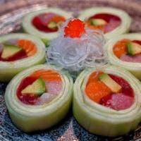 Trio Naruto · Tuna, salmon, yellowtail and avocado wrapped with thinly sliced cucumber.