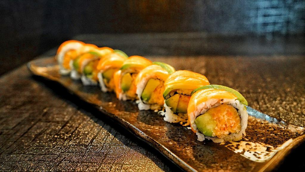Tiger Roll · Spicy kani. Topped with fresh salmon and avocado.