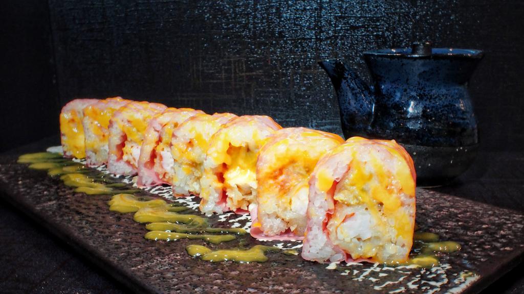 Paradise Roll · Lobster salad, shrimp tempura and fried banana wrapped in soybean paper served w. mango sauce