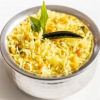 Lemon Rice · Lemon flavored basmati rice, curry leaves, mustard seeds.