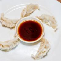Dumpling Soup · Choice of steamed beef or pork and vegetable.