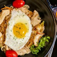Yaki Soba Chicken · Stir-fried noodle with chicken served with a sunny side up egg.