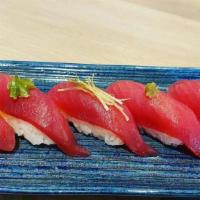 Tuna Lover · Five pieces tuna sushi and a tuna avocado roll. Miso soup and salad.