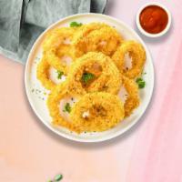 Ring Me Up (Onion Rings) · (Vegetarian) Sliced onions dipped in a light batter and fried until crispy and golden brown.