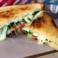 Garden Melt · Asiago, Roasted Red Peppers, Arugula and Olive Tapenade on Levain Pullman