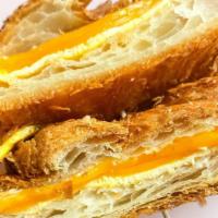 Croissant Egg & Cheese · A fresh baked croissant toasted with cheddar cheese and eggs.