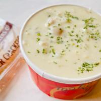 New England Clam Chowder (Cup) · A blend of tender sweet whole clams, clam broth, fresh cream, natural cut potatoes, and roux...