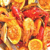 Pick 3 Seafood- Get  Free Mussels, Clams, Crawfish, Shrimp, Calamari · This order comes with 3 corns and 3 potatoes