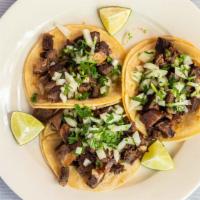 Barbacoa Tacos · Order of three oven-baked goat tacos. Served on soft corn tortilla with onions and cilantro.