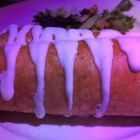 Chicken Breast Chimichanga · Deep-fried flour tortilla filled with Mexican rice, beans, onions, and cheese. Topped with s...