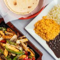 Chicken Breast Fajitas · Sautéed onions, red peppers, and green peppers served with grilled chicken, Mexican rice, be...